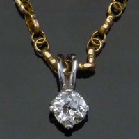 Lot 334 - Single diamond pendant on chain.