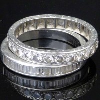Lot 336 - Platinum eternity ring and a white metal eternity