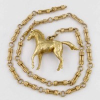 Lot 345 - 9ct gold horse on chain.