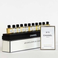 Lot 478 - A bottle of Chanel no. 5 unopened, and a rare edition of 11 4ml Chanel bottled perfumes