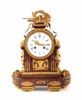 Lot 462 - A 19th century French rouge marble mantel clock