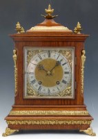 Lot 676 - Oak and brass mantel clock.