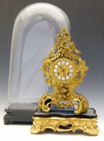 Lot 678 - French mantel clock under glass dome.