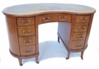 Lot 717 - Edwardian mahogany kidney shaped desk