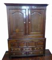 Lot 733 - Mid 18th century oak livery cupboard