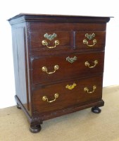 Lot 740 - George III oak chest of two short and two long drawers