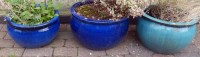 Lot 762 - Two blue and one green ceramic planters.