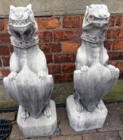Lot 769 - Pair of pre-cast Griffins standing on bases.