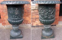 Lot 773 - Two cast iron urns 83cm diameter and