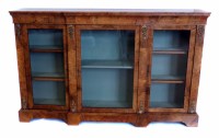 Lot 563 - Victorian walnut breakfront bookcase or display cabinet