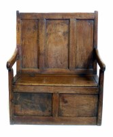 Lot 541 - 18th century oak box settle, three panel back