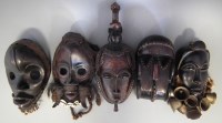 Lot 17 - Gre mask, two Dan masks, a Baule mask and one