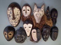 Lot 19 - Eleven African masks carved in Lega, Chokwe