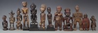 Lot 21 - Twelve African figures, carved in various tribal