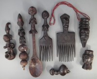 Lot 32 - Two combs, three pipes, a rattle, spoon and a