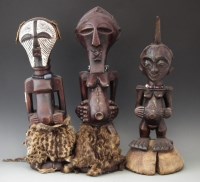 Lot 37 - Three Songye Nkisi Power figures or Fetishes, the