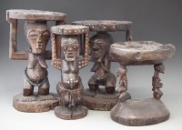 Lot 40 - Four Songye caryatid stools carved with Nkisi