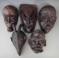 Lot 62 - Bamileke mask, Mambila mask and three others, (5)