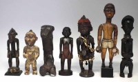 Lot 71 - Seven African figures carved in various tribal