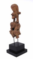Lot 80 - Bamileke pulley carved with a monkey riding on