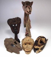 Lot 82 - Five African masks carved in various tribal