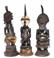 Lot 84 - Three Songye Nkisi power figures, the tallest