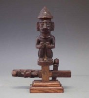 Lot 101 - Bambara door lock carved with a seated figure and
