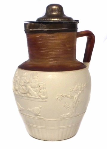 Lot 71 - Turner cock fighting jug, moulded with figure