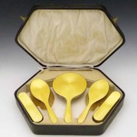Lot 185 - Yellow guilloche enamel dressing table set, cased