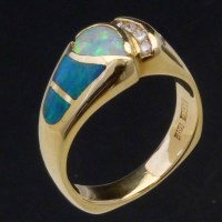 Lot 223 - 14K gold opal and diamond ring