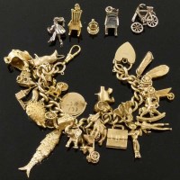 Lot 234 - Gold charm bracelet and some loose charms