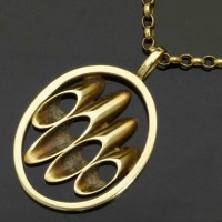Lot 244 - Gold oval pendant on 9K chain