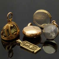 Lot 269 - Antique gilt metal faience scarab seal; 9ct hieroglyph pendant; locket; two pendants