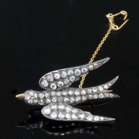 Lot 276 - Victorian rose diamond swallow brooch