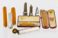 Lot 6 - Five gold banded cigarette holders, three cigar