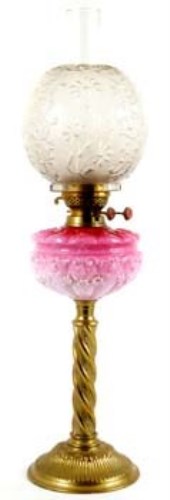 Lot 53 - Oil lamp with pink glass reservoir.