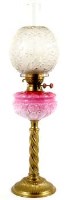 Lot 53 - Oil lamp with pink glass reservoir.
