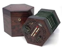 Lot 116 - Hexagonal concertina with case and book.