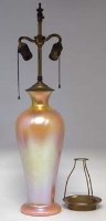 Lot 131 - American iridescent orange tall vase as a table
