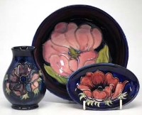 Lot 229 - Moorcroft magnolia bowl, anemone vase and a dish.