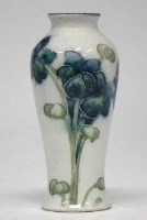Lot 241 - Macintyre Moorcroft miniature vase.