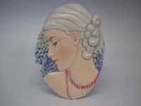Lot 280 - Beswick lady with beads wall plaque