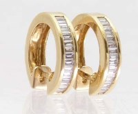 Lot 375 - Pair of 18ct gold and baguette diamond circular