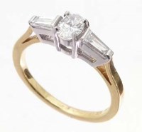 Lot 388 - 18ct gold and oval diamond ring with baguette
