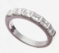 Lot 393 - Plainum half eternity ring set with seven