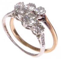 Lot 413 - Two 3-stone diamond rings.