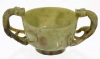 Lot 456 - Chinese green jade two-handled cup on stand.
