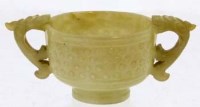 Lot 457 - Chinese celadon jade two-handled cup.
