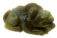 Lot 490 - Chinese green jade carving of a crouching kylin