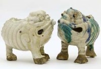 Lot 504 - Two Chinese stoneware mythical toads.